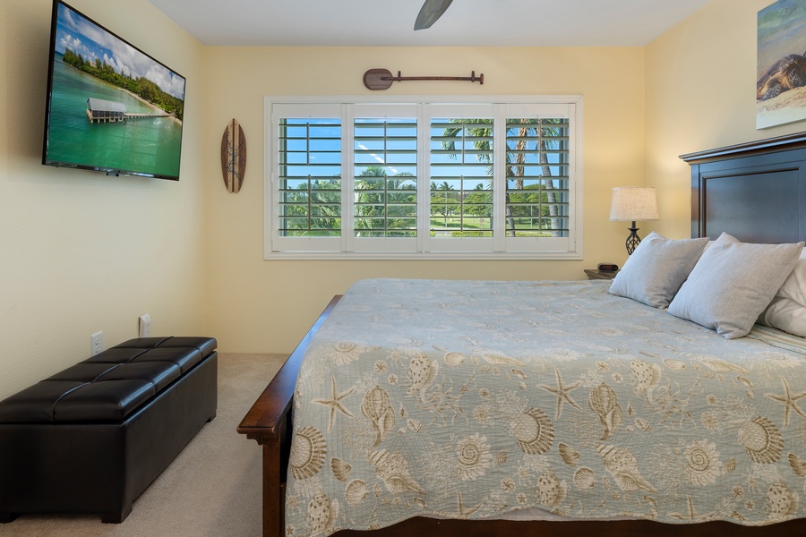 Relax in the Primary bedroom with a queen-size bed and bright natural light.