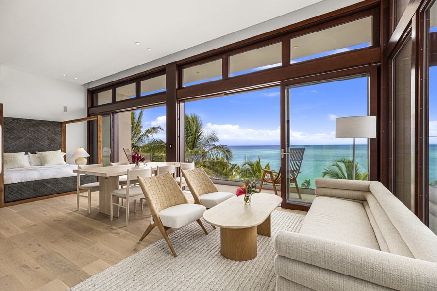 Cozy and contemporary living area with floor-to-ceiling windows that bring the outdoors in.