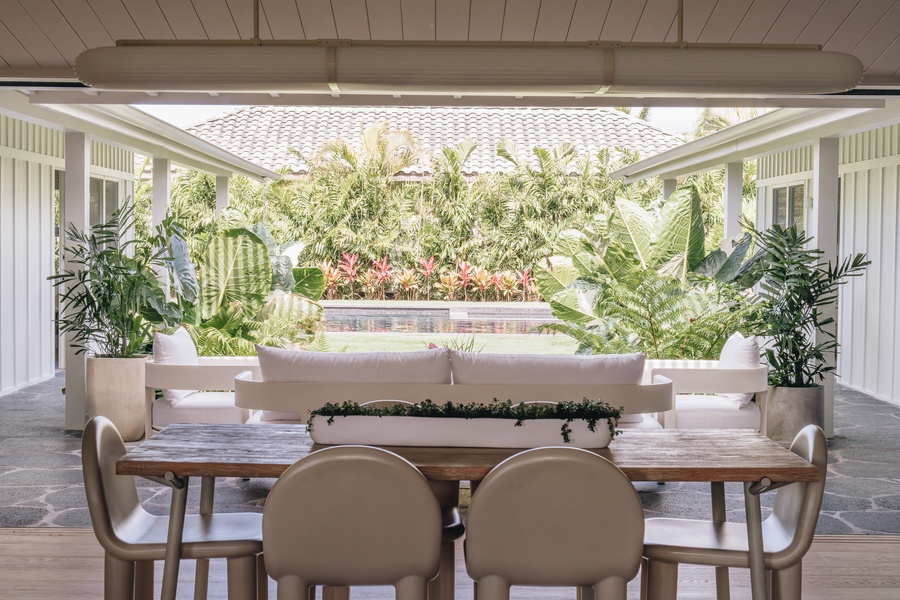 Gather for relaxed meals and conversation in this shaded outdoor dining space.