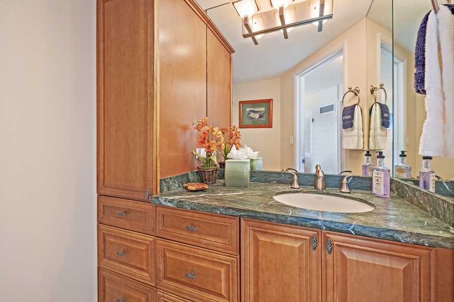 The bathroom at Royal Kahana 610 offers a spacious vanity with ample storage, perfect for your daily routines.