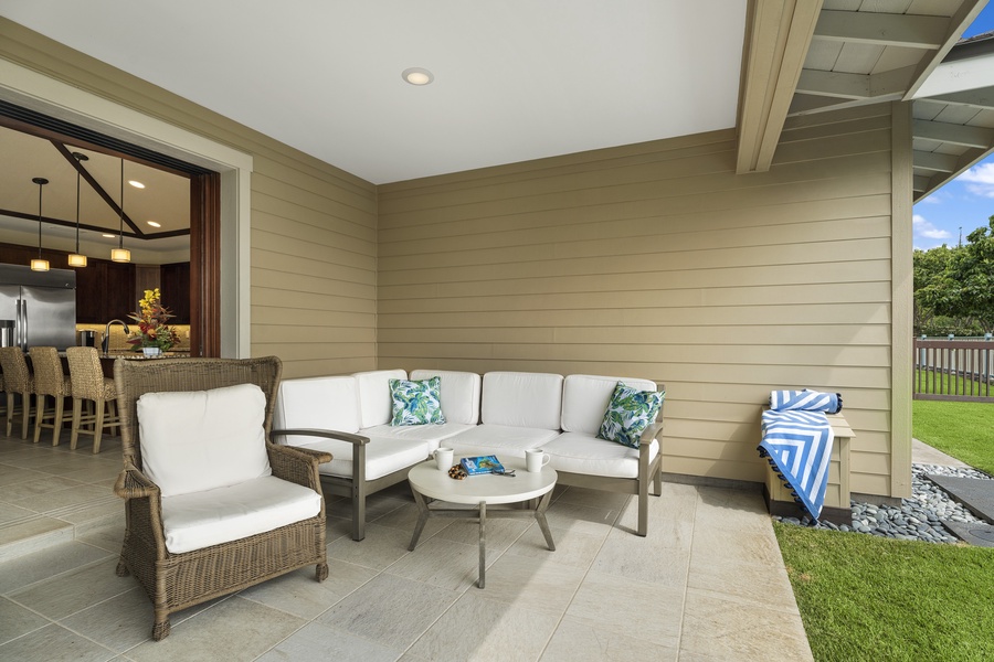 Covered Lanai with additional seating, a perfect spot for your morning coffee.