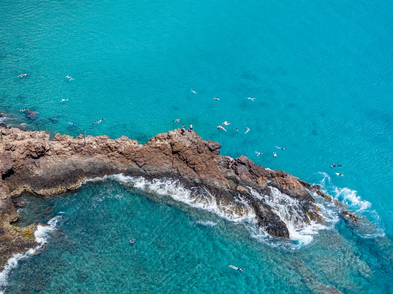 Lava-rock shores and turquoise water promise adventure near Honua Kai Konea 204.
