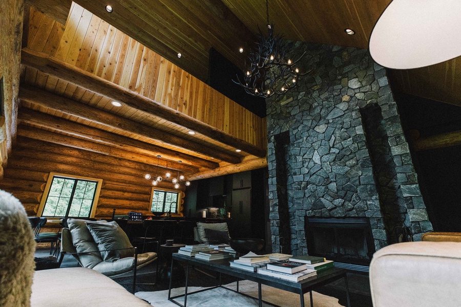 Unwind beside the soaring stone fireplace in the warm, timber-framed great room.