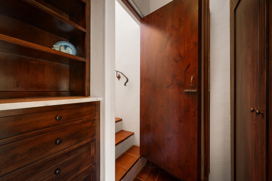 Your private retreat with rich wooden storage and thoughtful built-in shelving for all your belongings.