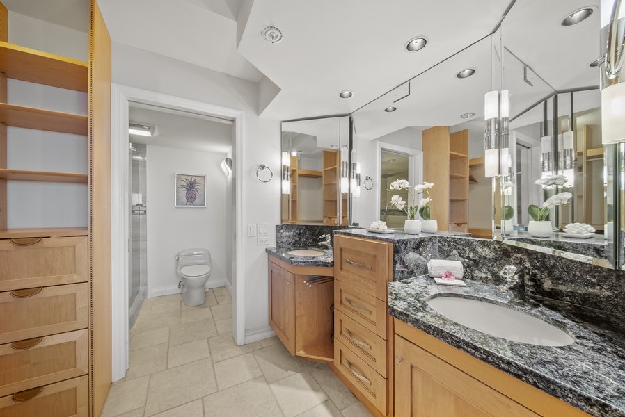 Ensuite main bathroom, offering dual vanities and a spa-like atmosphere.