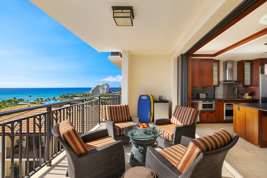 Inviting lanai space offering a panoramic view of the ocean.