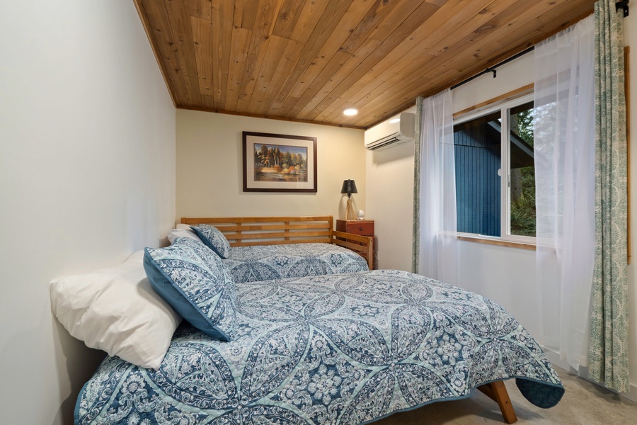Twin configuration shown here ensures every guest enjoys personalized comfort during their stay.