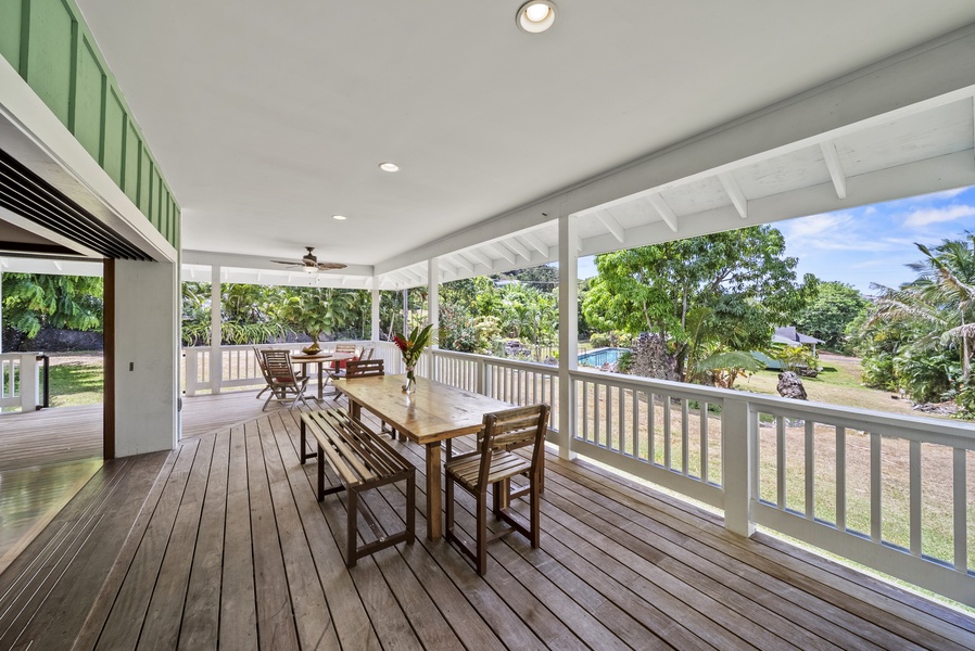 Large shaded lanai with seating for the whole group and garden views.