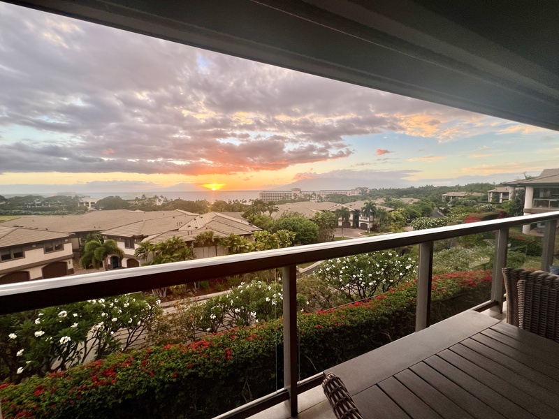 Enjoy a stunning sunset from your private lanai, where the vibrant colors of the sky meet the tranquil ocean horizon.