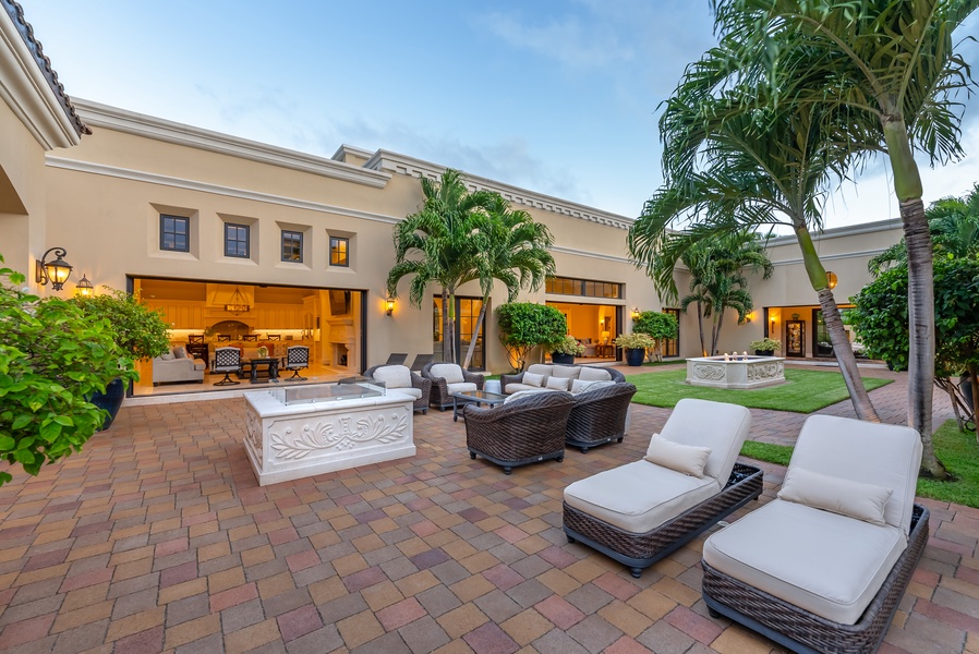 Outdoor seating area with plush furniture, offering a comfortable spot to enjoy the fresh air.