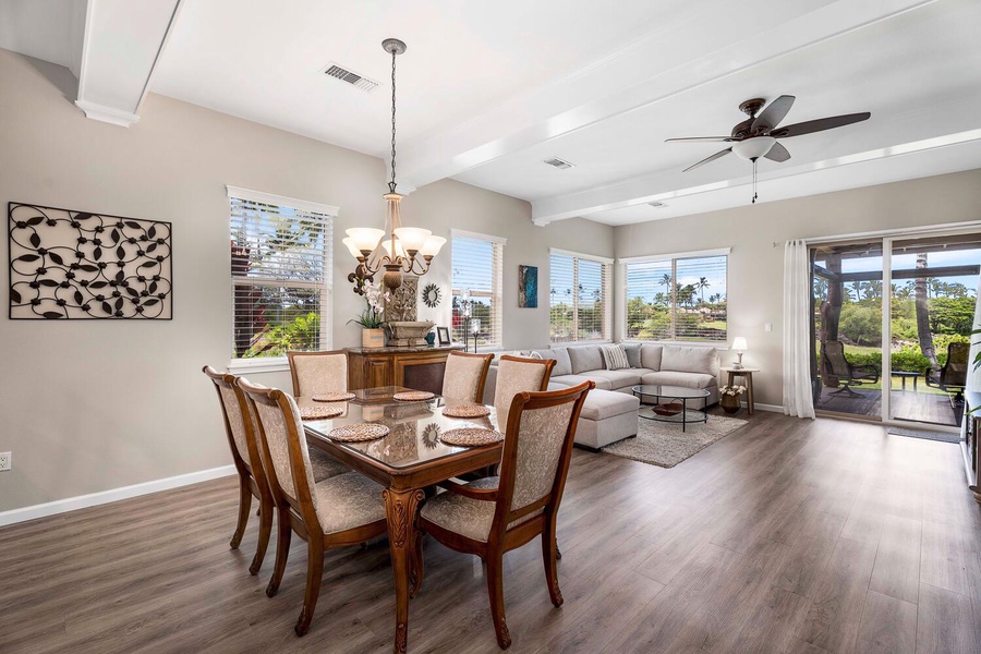 The dining and living areas have views to the tropical resort.