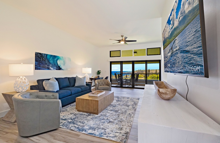 The living room at Kapalua Ridge 1421 boasts high ceilings, large windows, and comfortable seating.