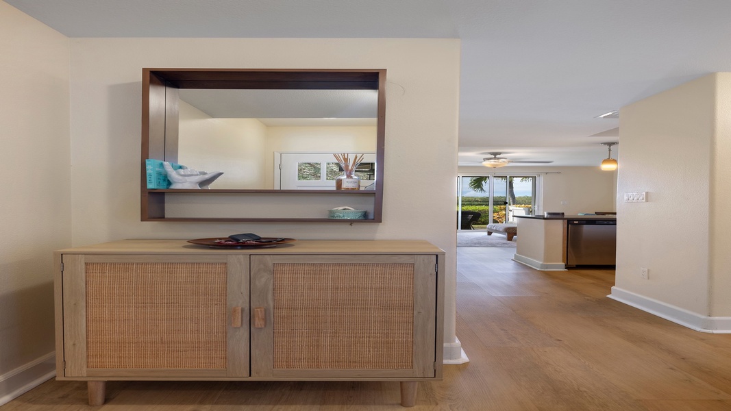 Natural light and open sightlines create an inviting transition from the entryway into the bright and spacious main living space.