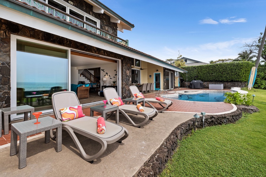 Lounge poolside on cushioned chairs, with ocean air, sunshine, and space to fully unwind.