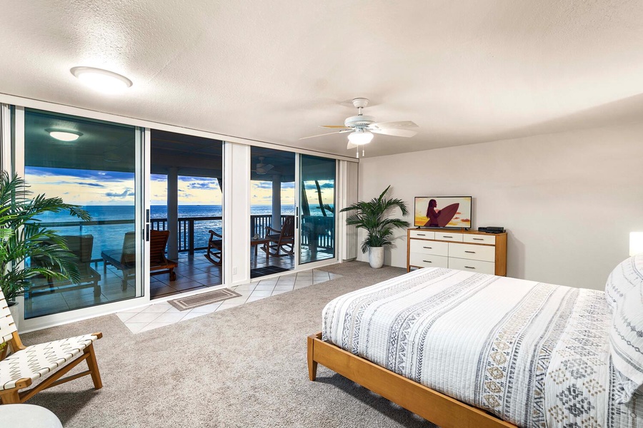 Primary bedroom has sliders to the lanai with amazing views.