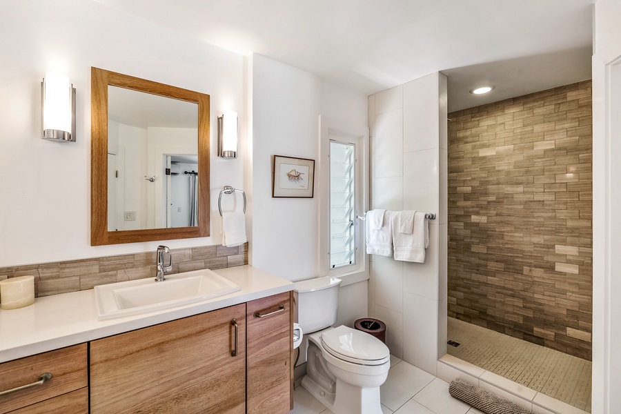 This full bath has a walk-in shower as well