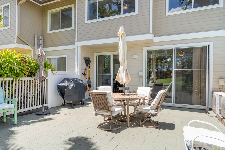 Your private lanai awaits with outdoor dining, BBQ grill, and tropical landscaping—perfect for morning coffee or evening meals.