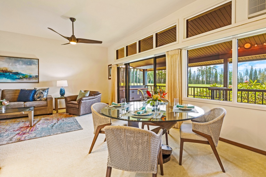 Enjoy a meal with a view in this inviting dining space, which opens up to the lanai and offers scenic views