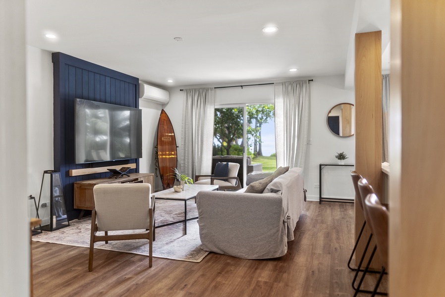 Bright and airy living room featuring stylish furnishings, high ceilings, and natural light — ideal for memorable family moments.