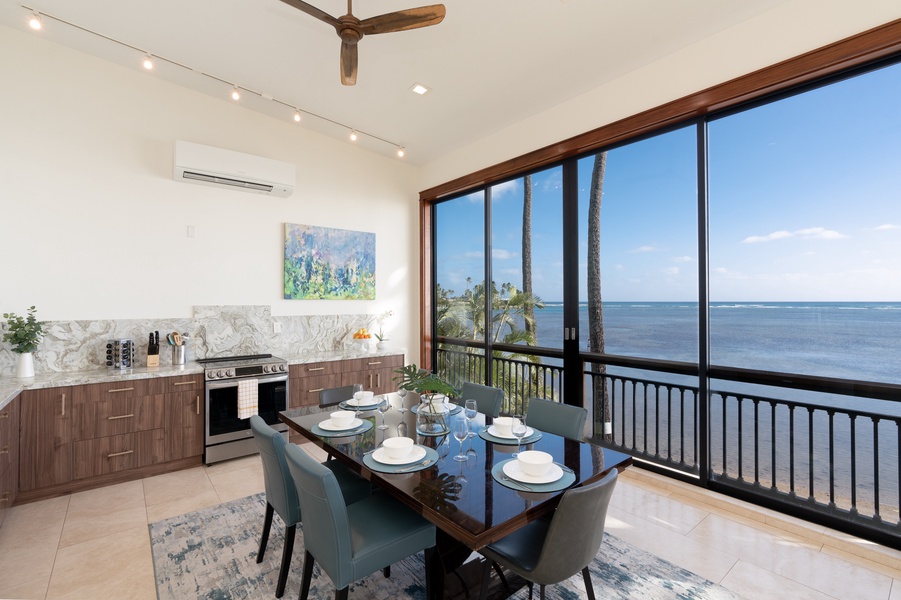 Open concept dining and kitchen with views.