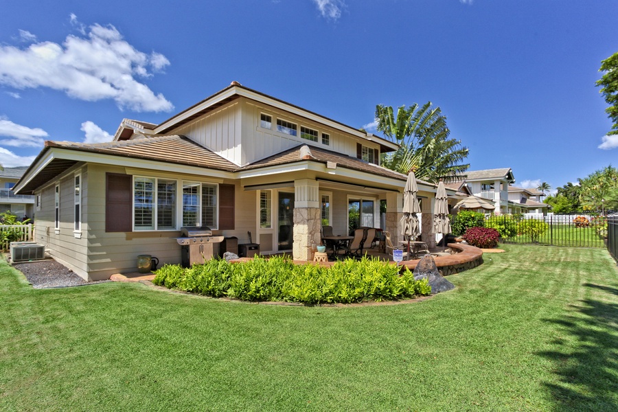 The manicured lawns of the golf course around the home.