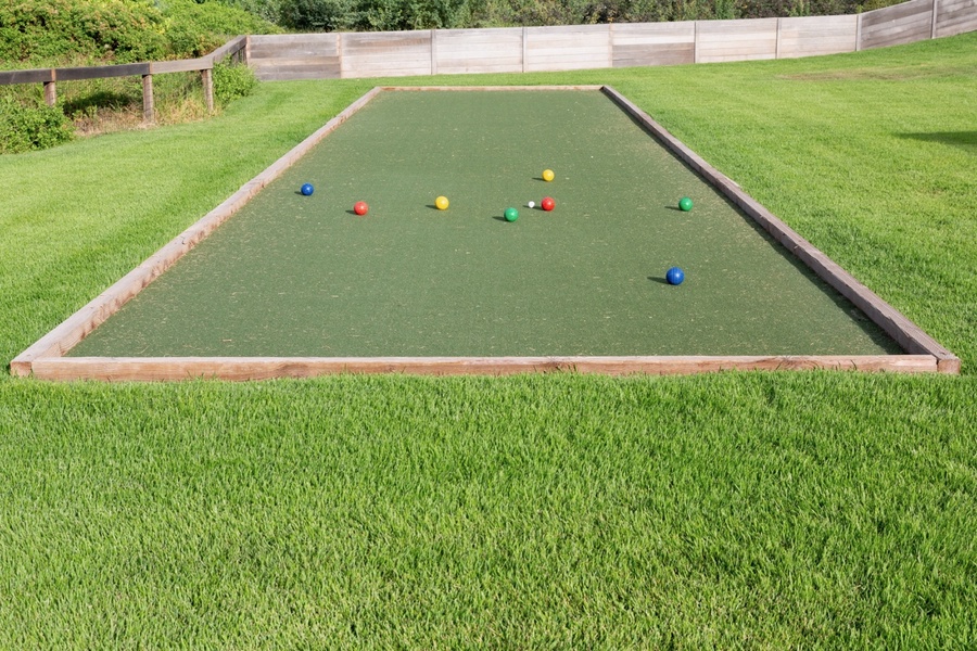 Bocce court framed by manicured lawn—game-ready and sun-lit.