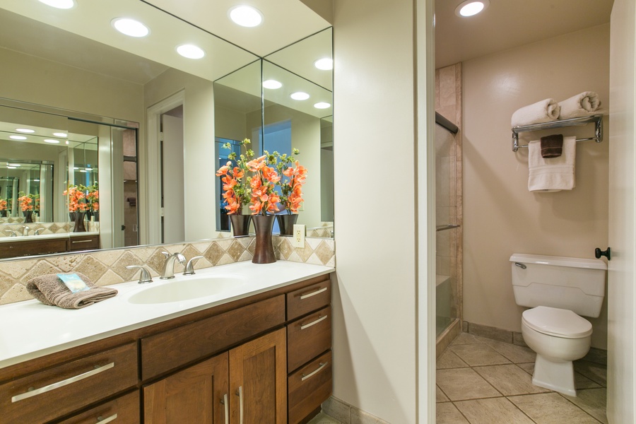 The ensuite bathroom has separate shower and single vanity.