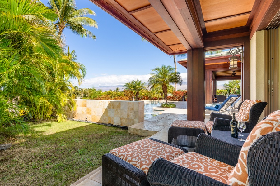 Take in garden and mountain views from your shaded lanai lounge just outside the primary suite.