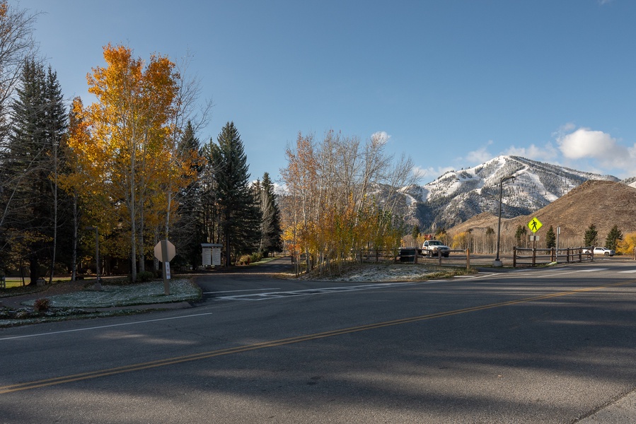 Let the serene mountain backdrop and vibrant fall foliage guide your journey as you navigate this tranquil neighborhood.