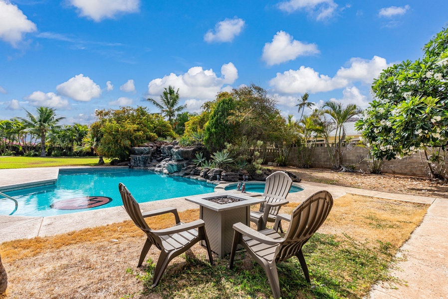 Shaded seating by the pool for relaxation and conversation.