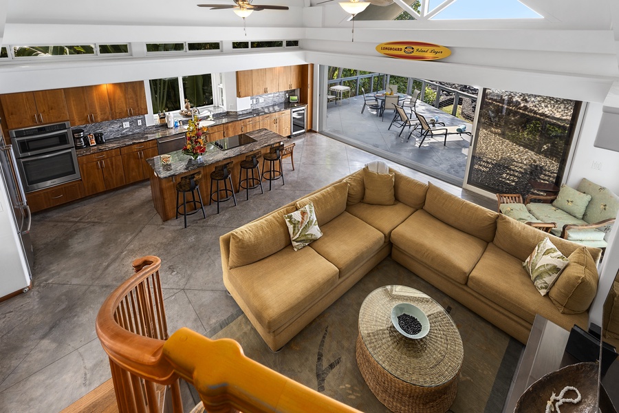 Overlooking the main living area, the loft showcases breezy architecture and coastal design.
