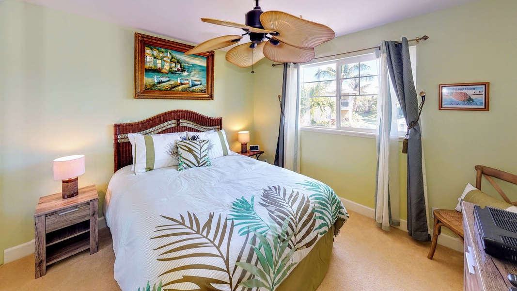 The primary guest bedroom with Polynesian decor and scenery.