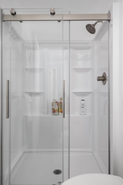 Dual-entry standing shower offers convenience and comfort for multiple guests.