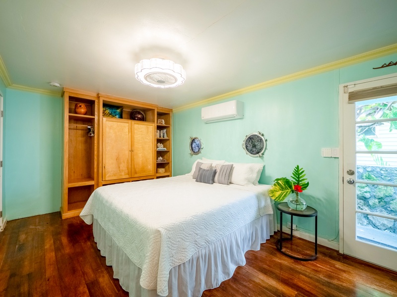 Drift off in your serene seafoam sanctuary, where warm wood tones and nautical touches create the perfect coastal retreat.