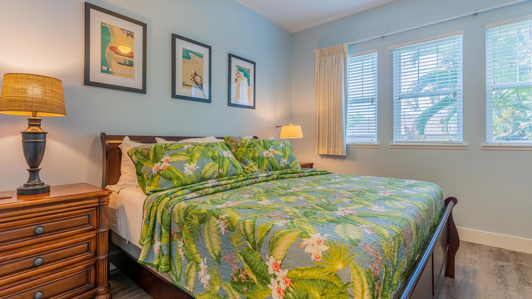 The primary guest bedroom has access to the lanai and a flat screen TV.