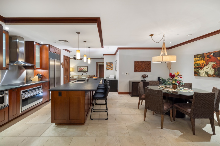 Spacious kitchen with island and dining area, perfect for family gatherings.