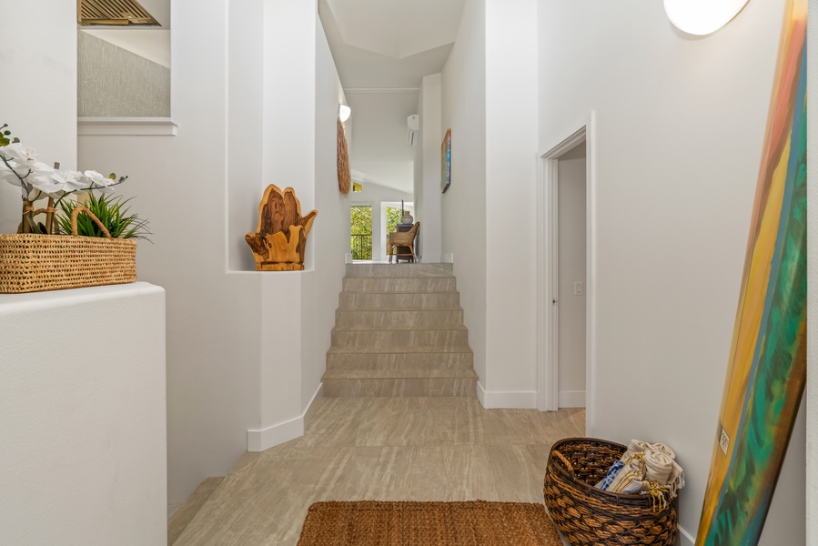Clean, airy hallway connects the living area with the tranquil bedrooms.