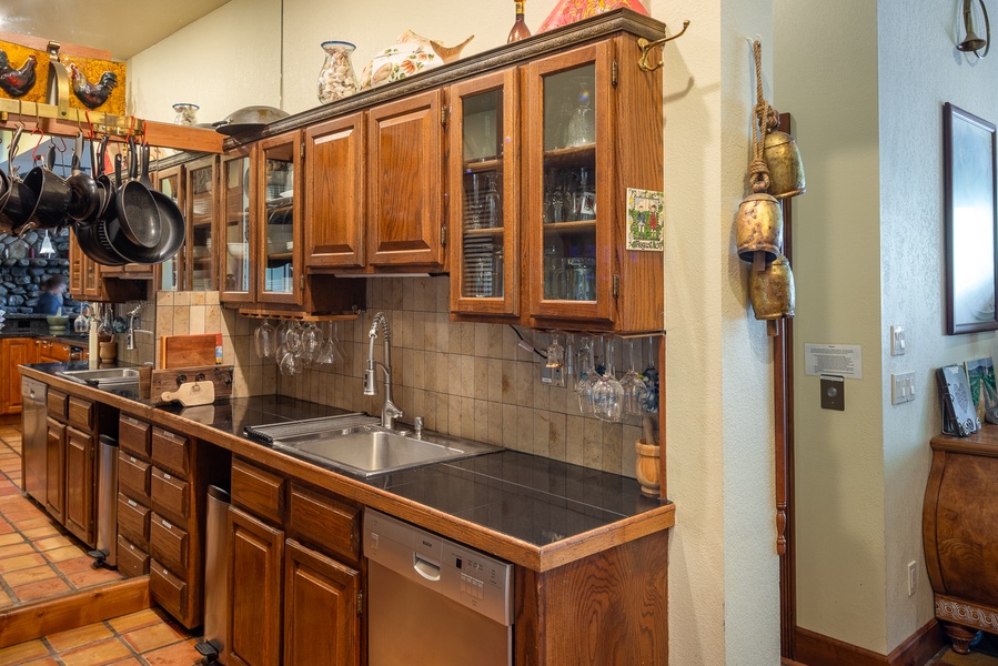 Wooden cabinetry and wide countertops.