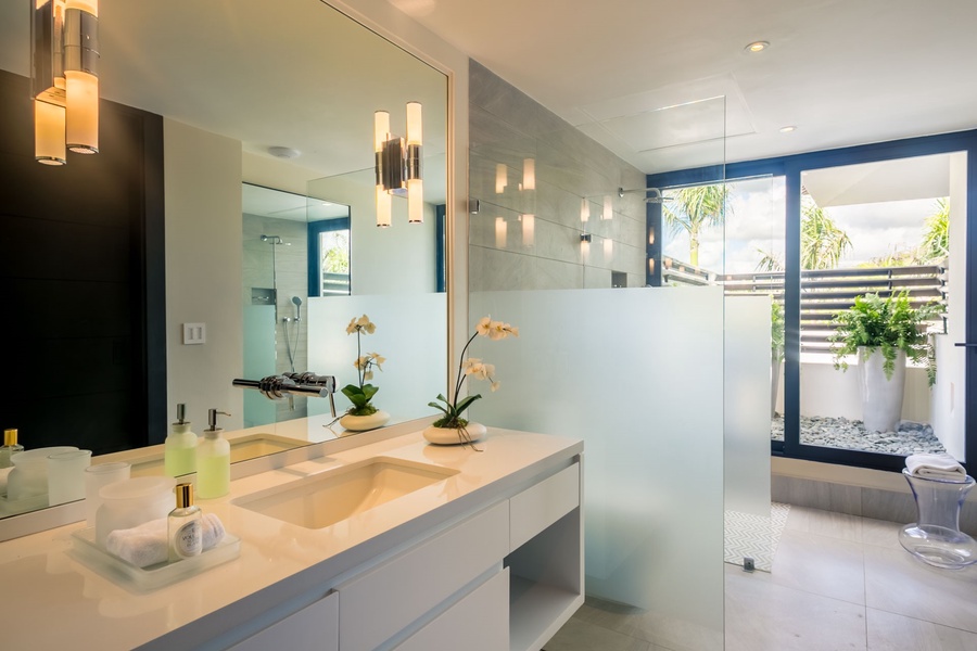 Contemporary ensuite bathroom with a sleek vanity and a walk-in shower.