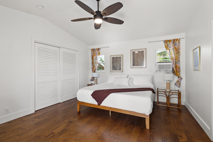 Comfortable bedroom with simple, modern decor and plenty of natural light.