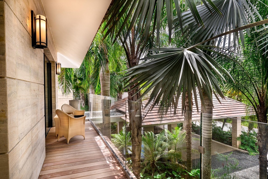Relax on this elegant balcony with comfortable seating.