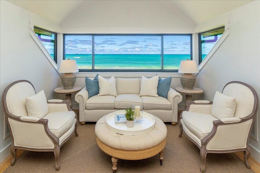 Second-story seating nook in the primary suite with unobstructed views of turquoise Kailua waters.
