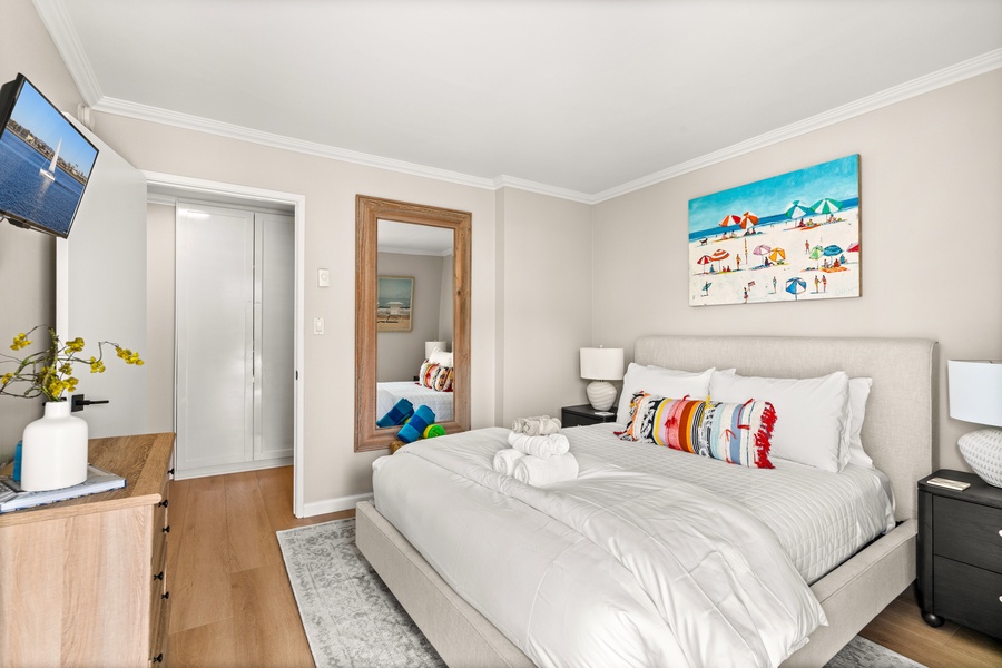 Primary bedroom with a plush king bed, ideal for recharging after La Jolla beach adventures.