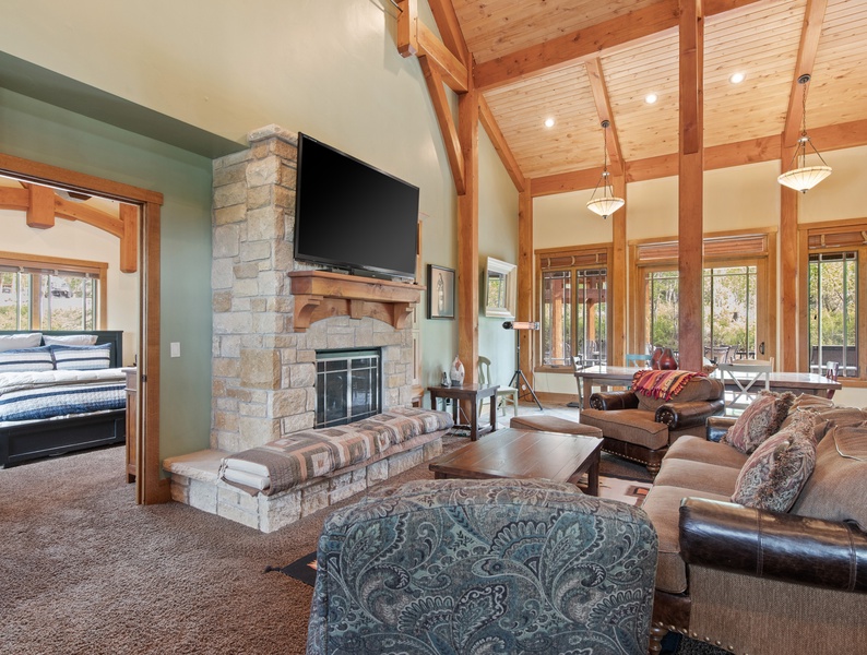 A cozy haven awaits: The living area boasts a comforting fireplace and offers convenient access to the master bedroom, creating a seamless retreat for relaxation and tranquility