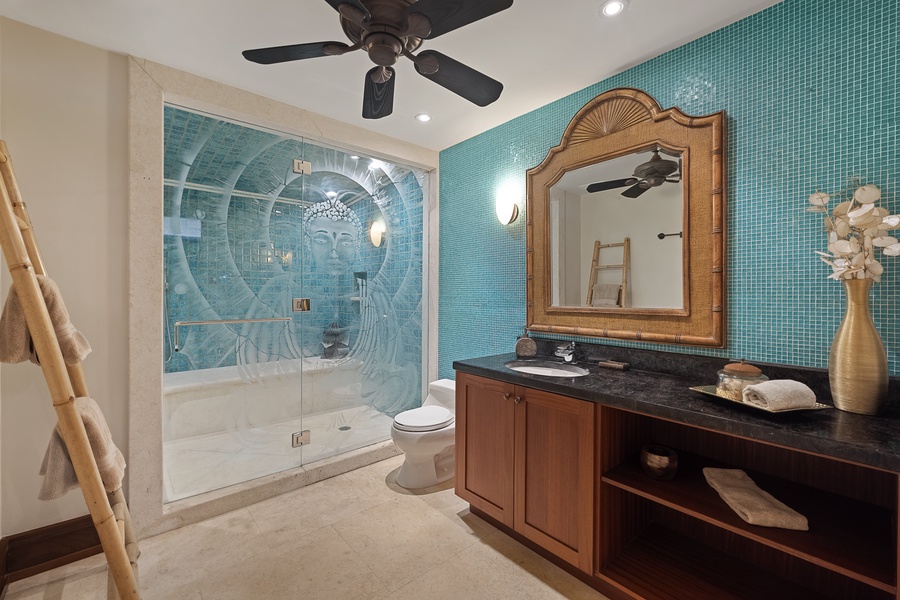 The downstairs shared guest bathroom has a single vanity and separate shower.