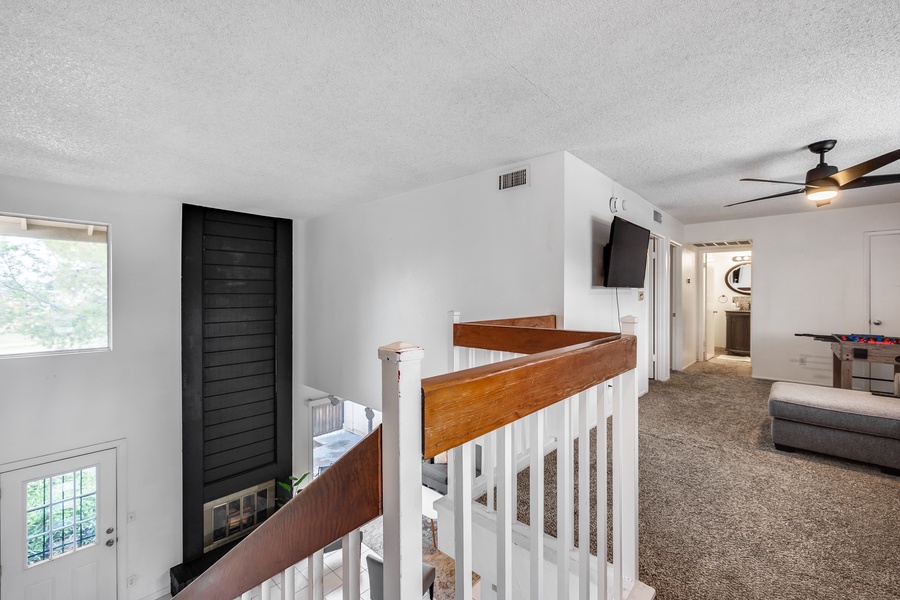 Upstairs, you'll find 2 additional guest bedrooms and an entertainment space