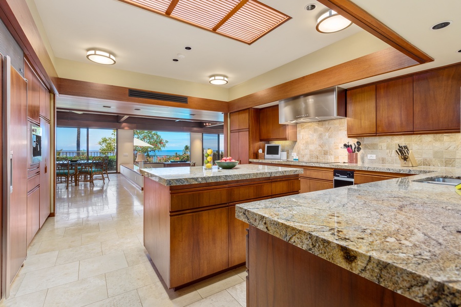 Ocean Views from the Spacious Open Kitchen w/Granite Countertops & Top-Tier Appliances.