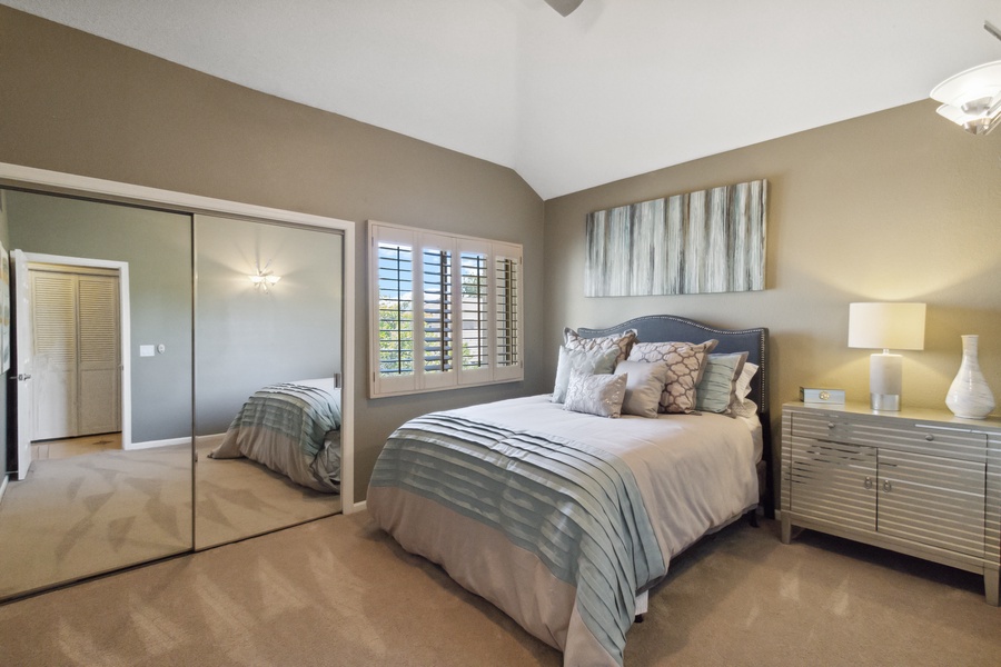 The guest bedroom, featuring an adjustable queen bed with double closets, is perfect for family or friends