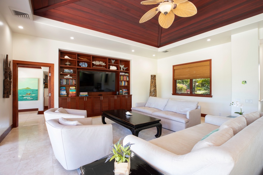 The expansive living area that opens directly to the lanai, a perfect spot for gathering and entertainment.