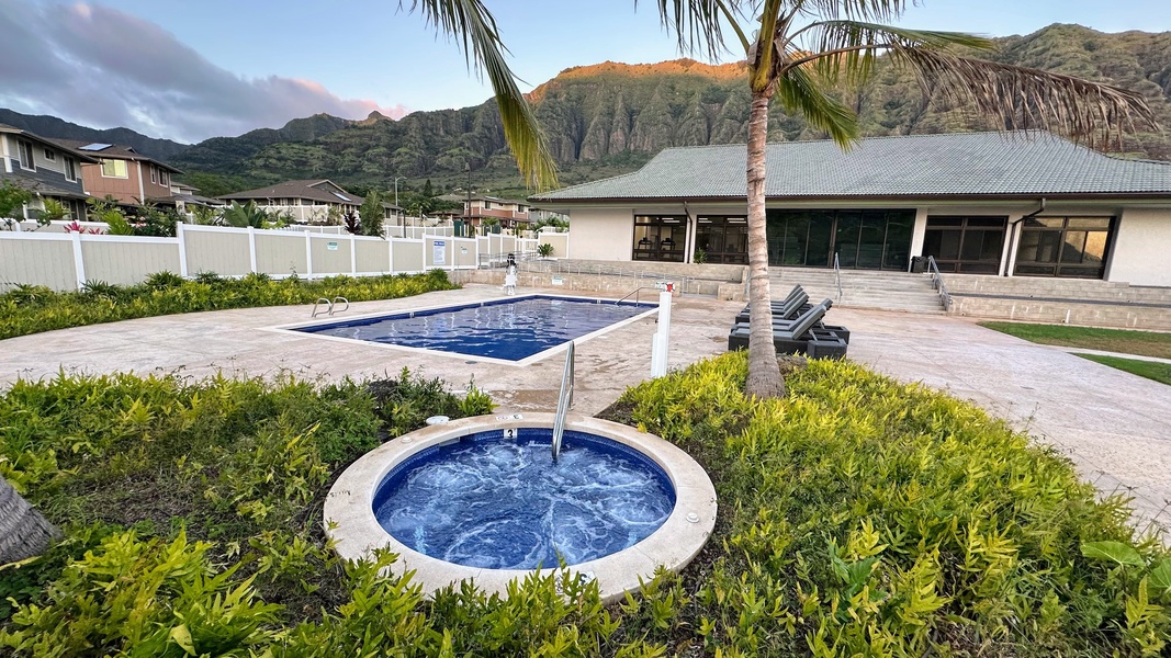 Soak your cares away in the hot tub surrounded by lush greenery and mountain peaks.